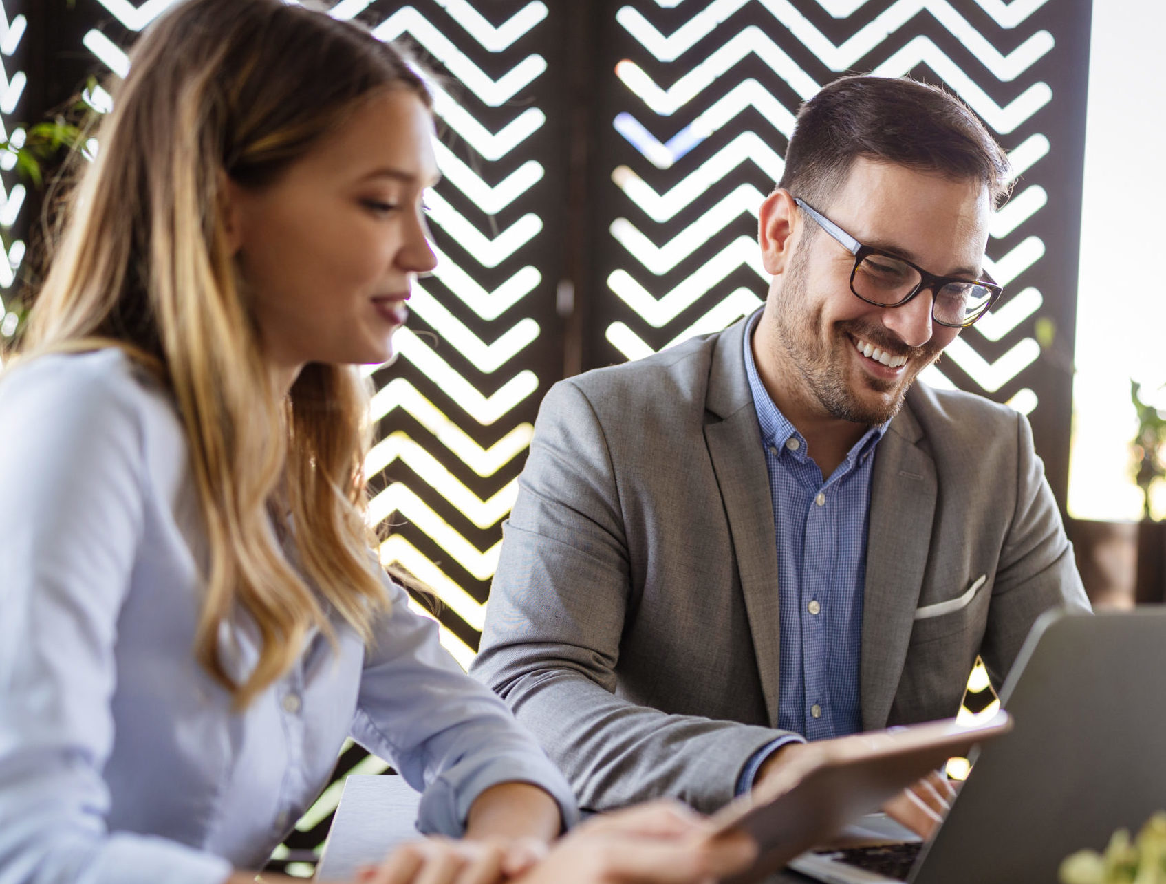 Woman consultant meeting with male client in a business casual setting